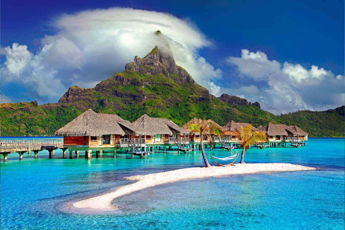 A panoramic view of Bora Bora overwater bungalows and turquoise waters.